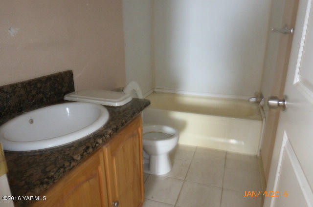 201 Mini Pines Road Yakima, WA 98903 - Photo 10 of 11 a bathroom with a sink and toilet