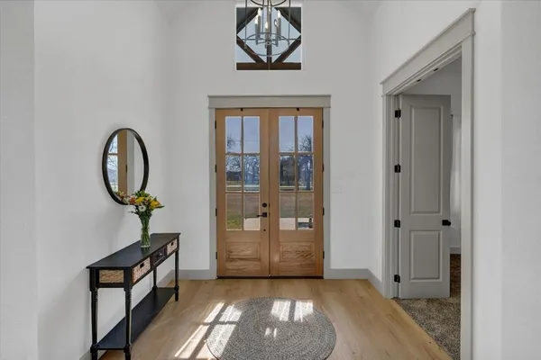 a view of an entryway with a chandelier