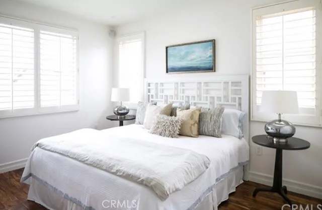 a bedroom with bed and a window