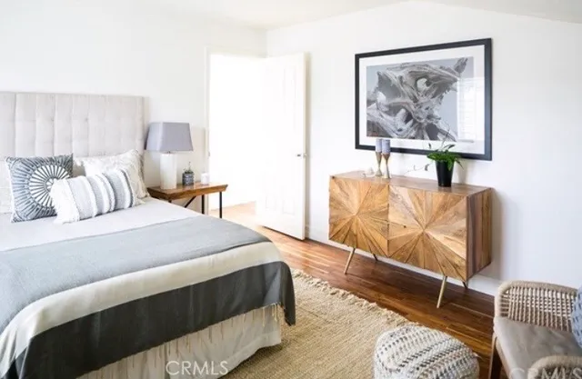 a bedroom with a bed and a couch