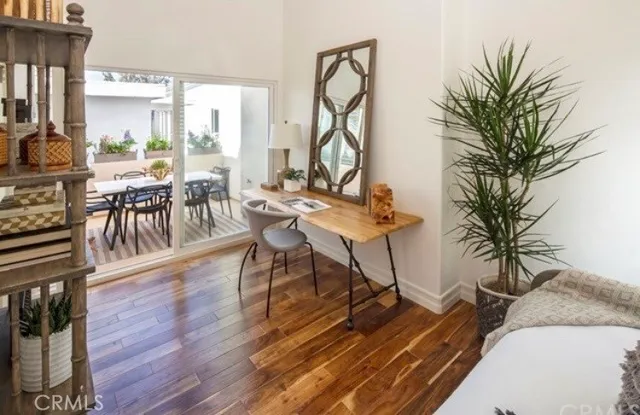 a view of a livingroom with furniture and a table