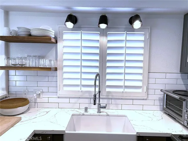 a kitchen with a sink and a stove