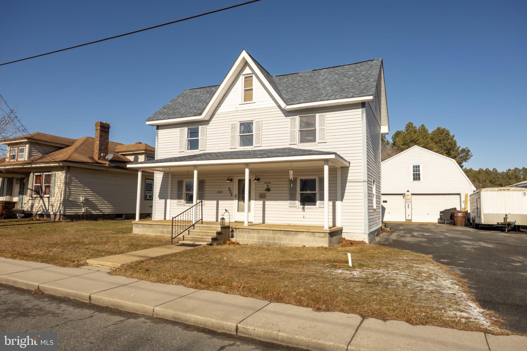 505 Main Street Mardela Springs, MD 21837 - Photo 1 of 60 a view of a white house with a outdoor space