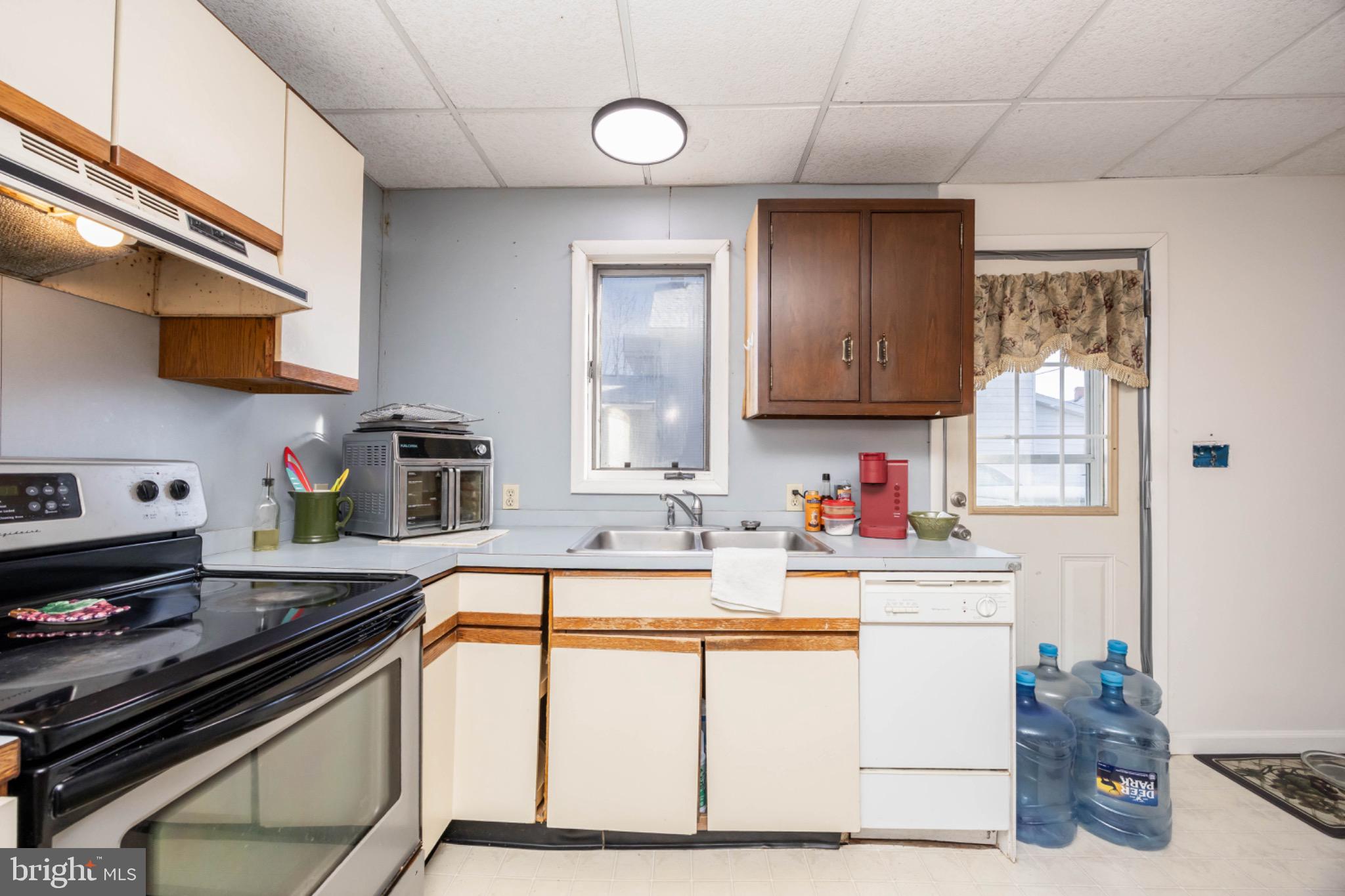 505 Main Street Mardela Springs, MD 21837 - Photo 20 of 60 a kitchen with stainless steel appliances a sink stove and cabinets