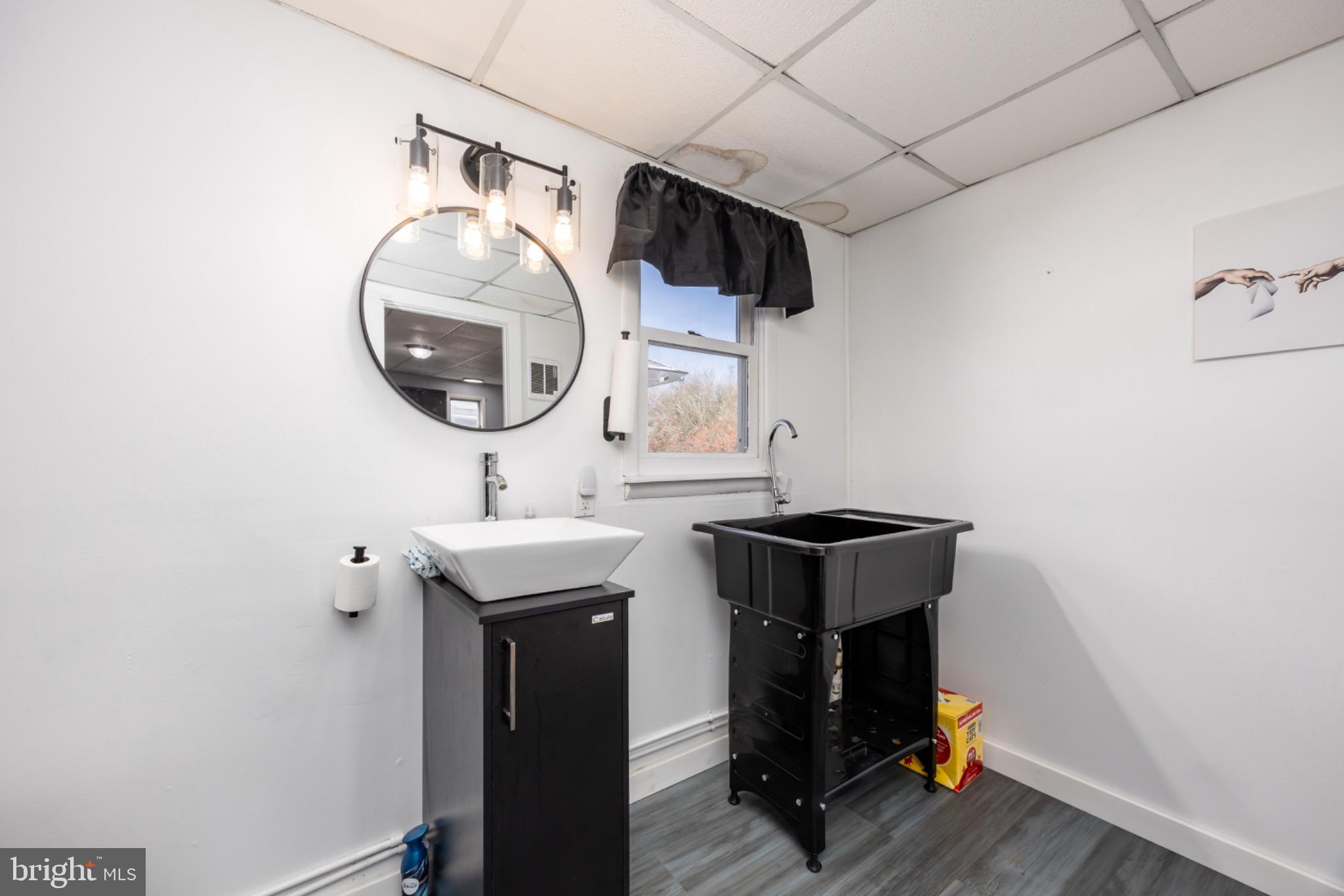 505 Main Street Mardela Springs, MD 21837 - Photo 25 of 60 a bathroom with a sink and a mirror