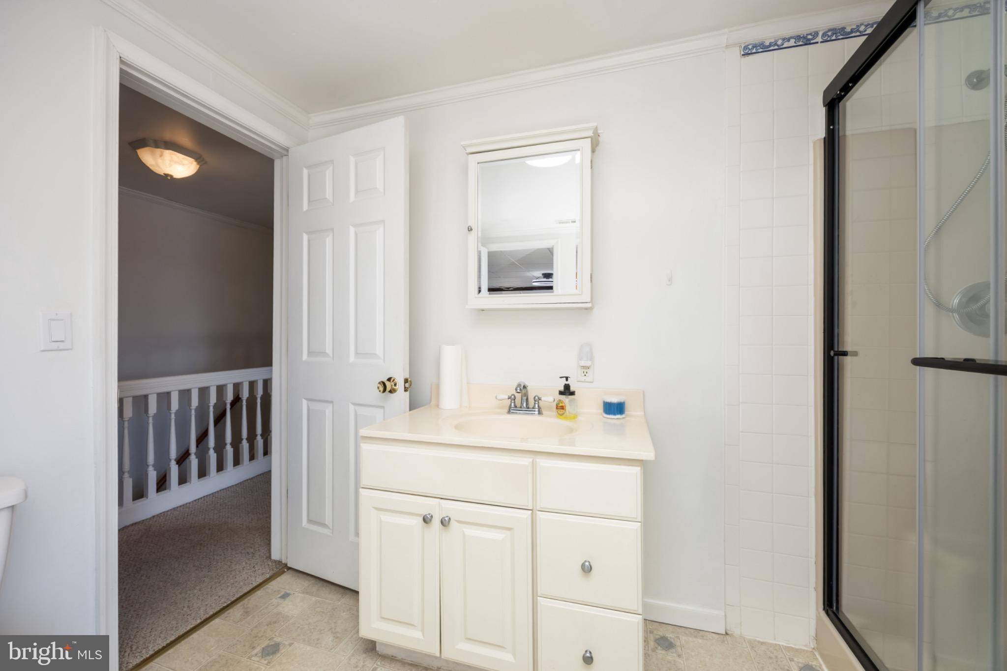 505 Main Street Mardela Springs, MD 21837 - Photo 35 of 60 a bathroom with a sink toilet and a mirror