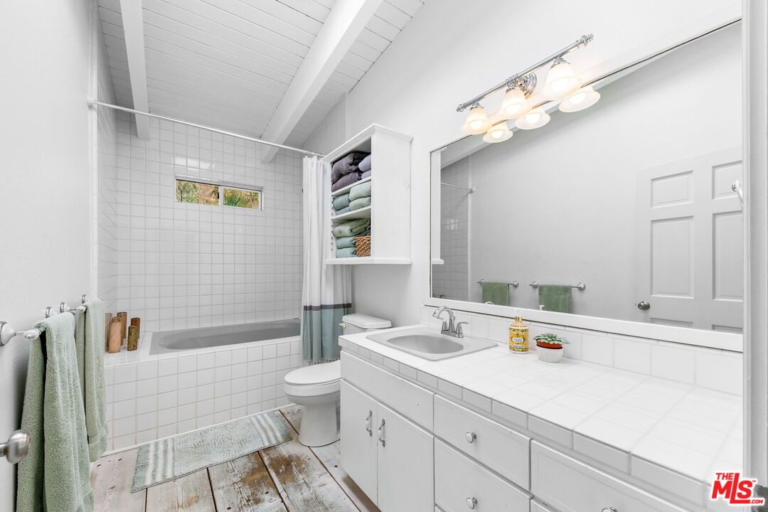 2302 Latigo Canyon Road Malibu, CA 90265 - Photo 17 of 30 a bathroom with a sink a toilet and shower