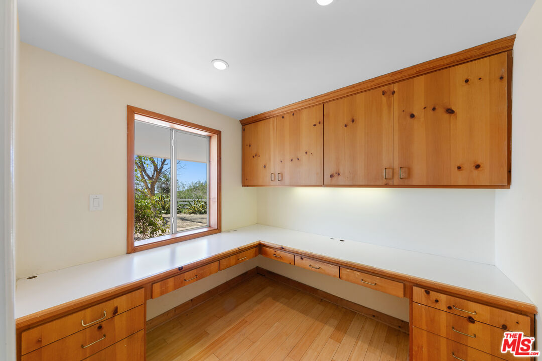 2302 Latigo Canyon Road Malibu, CA 90265 - Photo 19 of 30 a view of a kitchen with wooden floor and a window