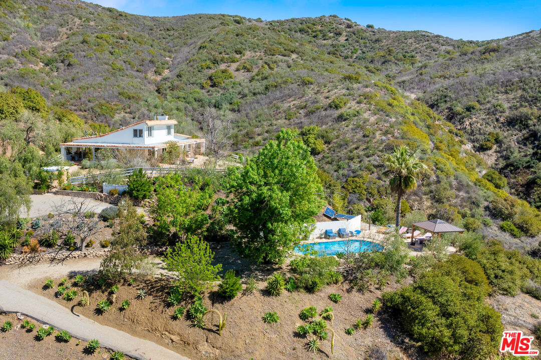 2302 Latigo Canyon Road Malibu, CA 90265 - Photo 22 of 30 an aerial view of a house with a yard
