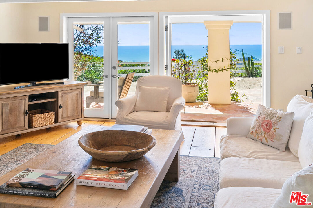 2302 Latigo Canyon Road Malibu, CA 90265 - Photo 3 of 30 a living room with furniture and a flat screen tv