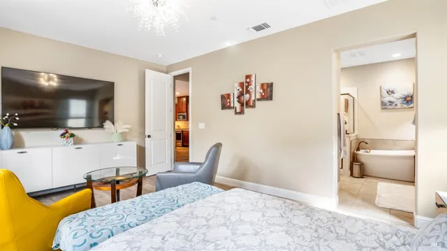 a bedroom with a bed and a couch