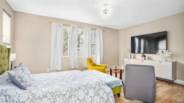 a bathroom with a tub a sink and a mirror