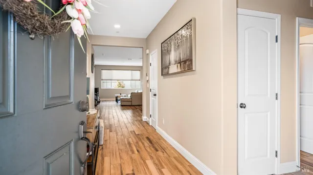 a view of a living room with wooden floor