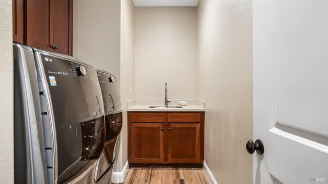 a bathroom with a sink a mirror and shower