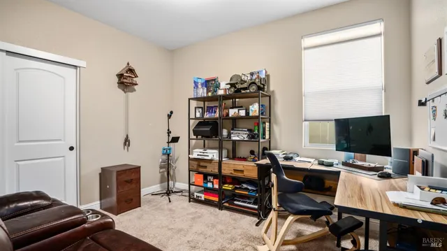 a bedroom with a workspace