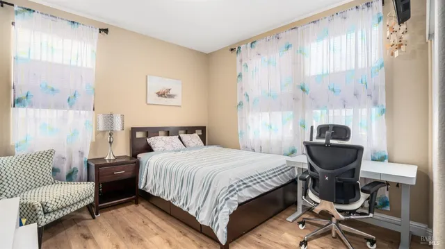 a bedroom with a bed and window