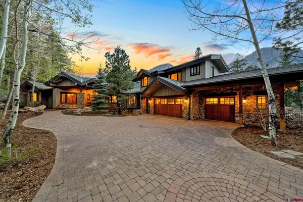 a bathroom with a granite countertop sink mirror and double