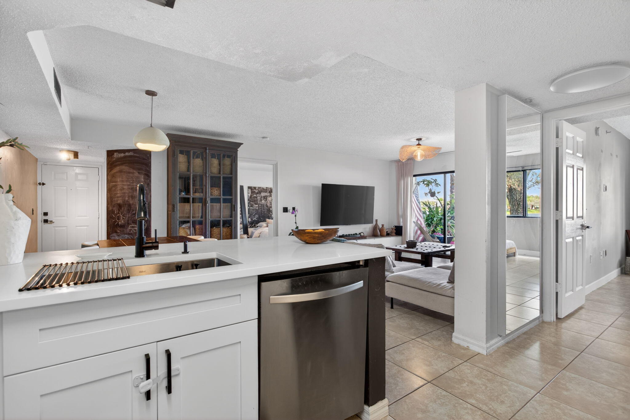 5011 Wiles Road, Unit 104 Coconut Creek, FL 33073 - Photo 16 of 43 a kitchen with a sink and cabinets