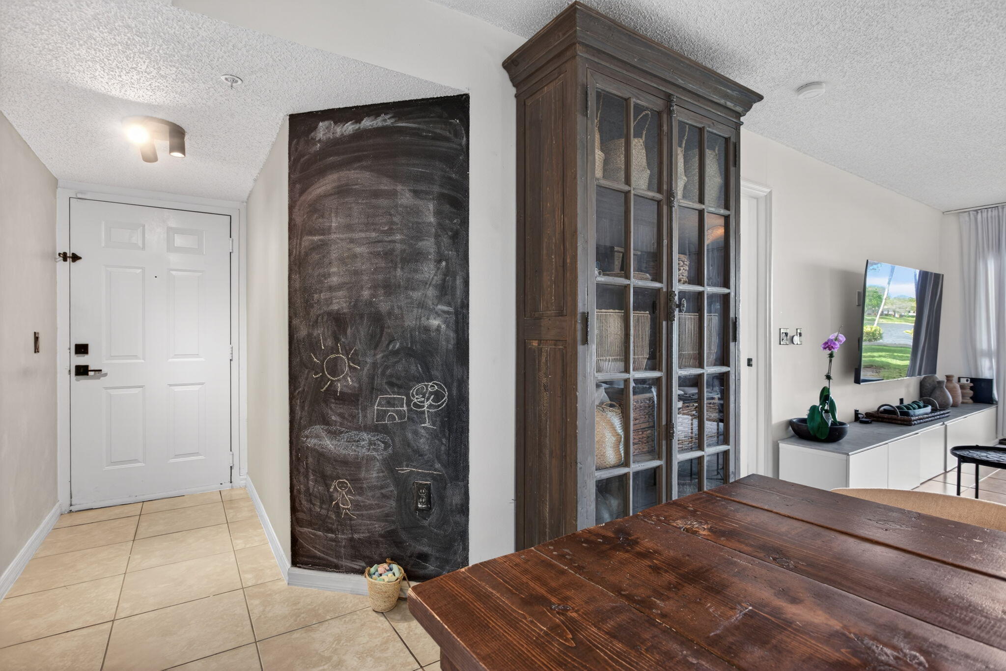 5011 Wiles Road, Unit 104 Coconut Creek, FL 33073 - Photo 28 of 43 a bedroom with a bed and a dresser