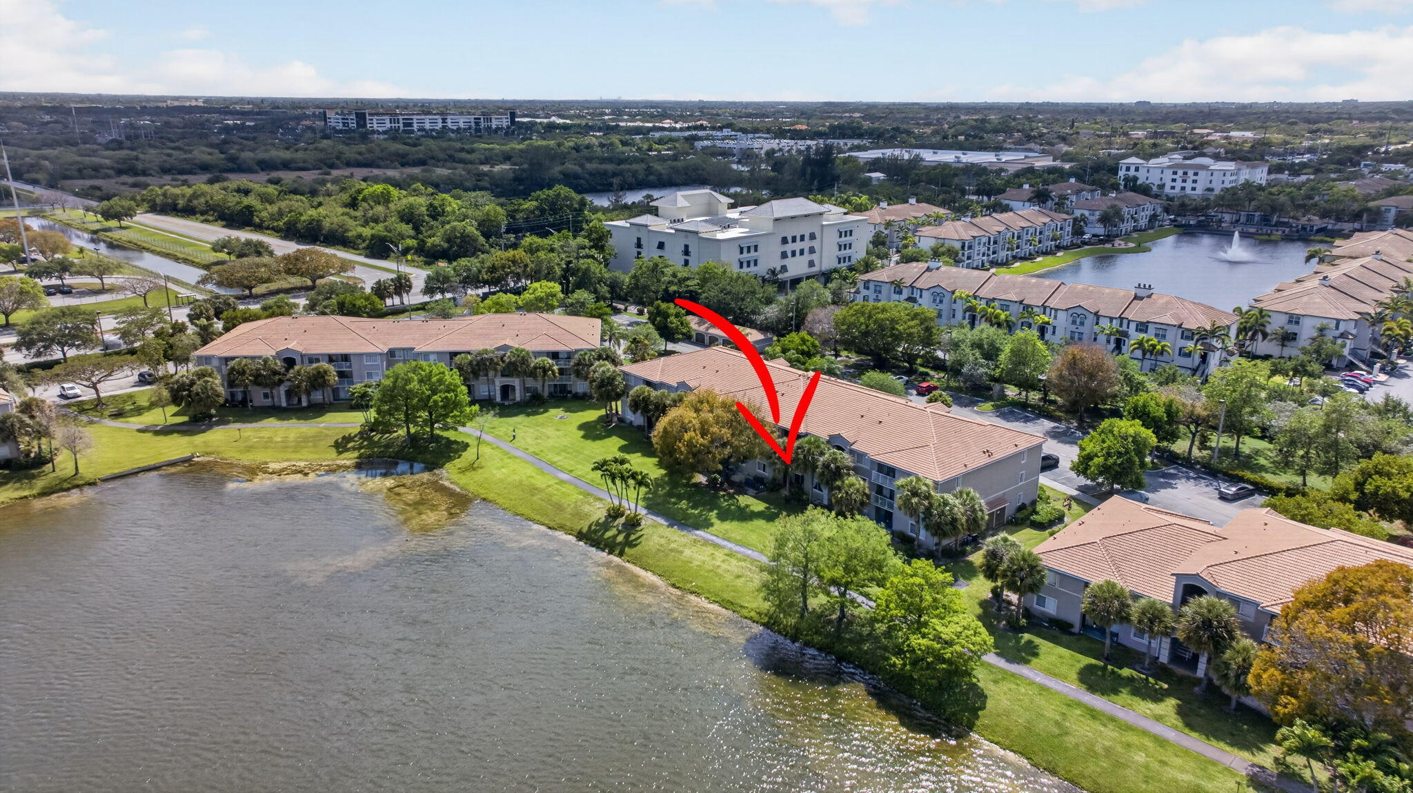 5011 Wiles Road, Unit 104 Coconut Creek, FL 33073 - Photo 33 of 43 an aerial view of a houses with a swimming pool