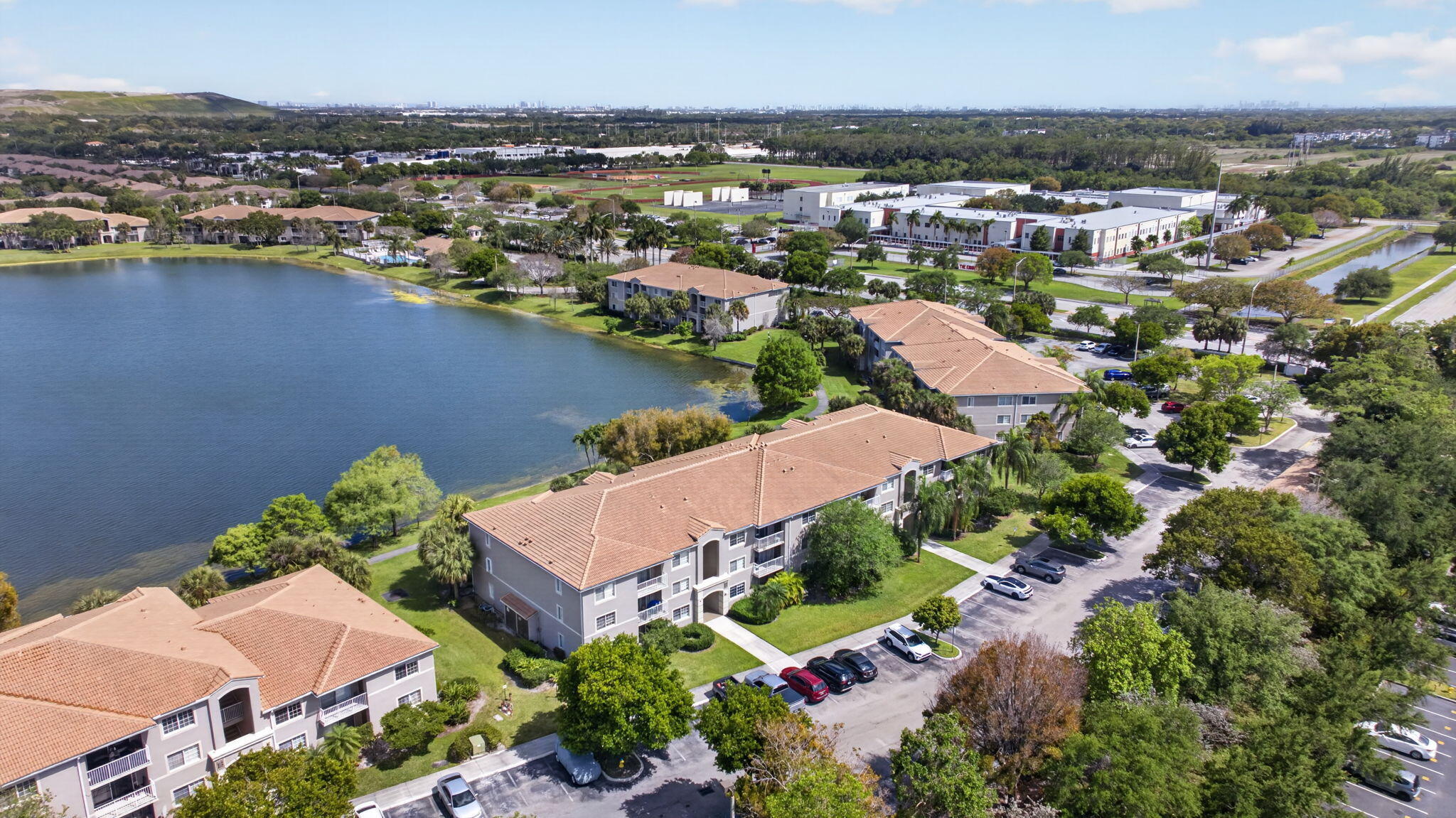 5011 Wiles Road, Unit 104 Coconut Creek, FL 33073 - Photo 34 of 43 an aerial view of residential houses with outdoor space