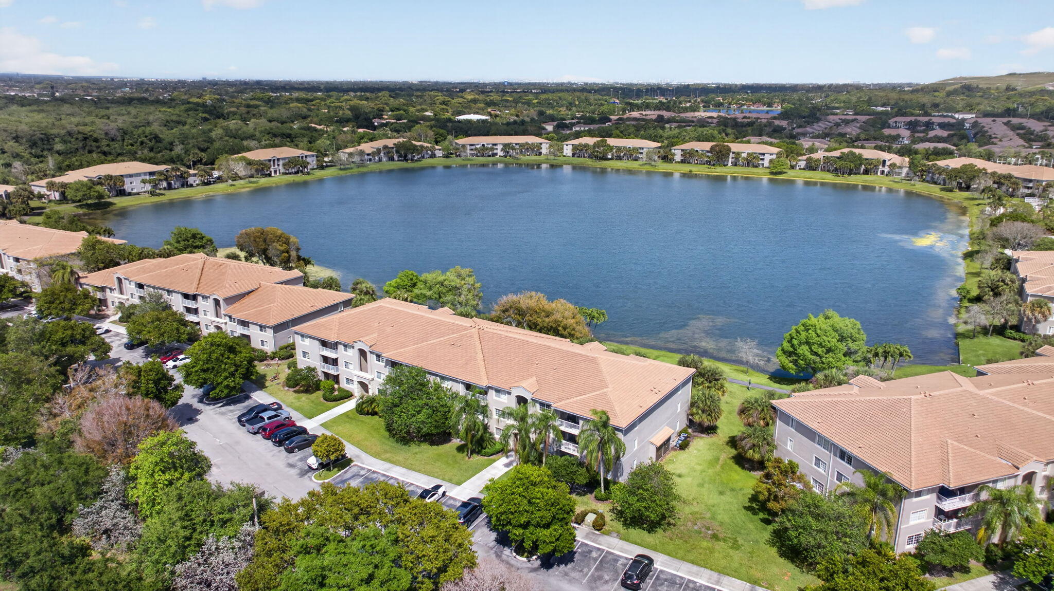 5011 Wiles Road, Unit 104 Coconut Creek, FL 33073 - Photo 35 of 43 an aerial view of residential houses with outdoor space and river