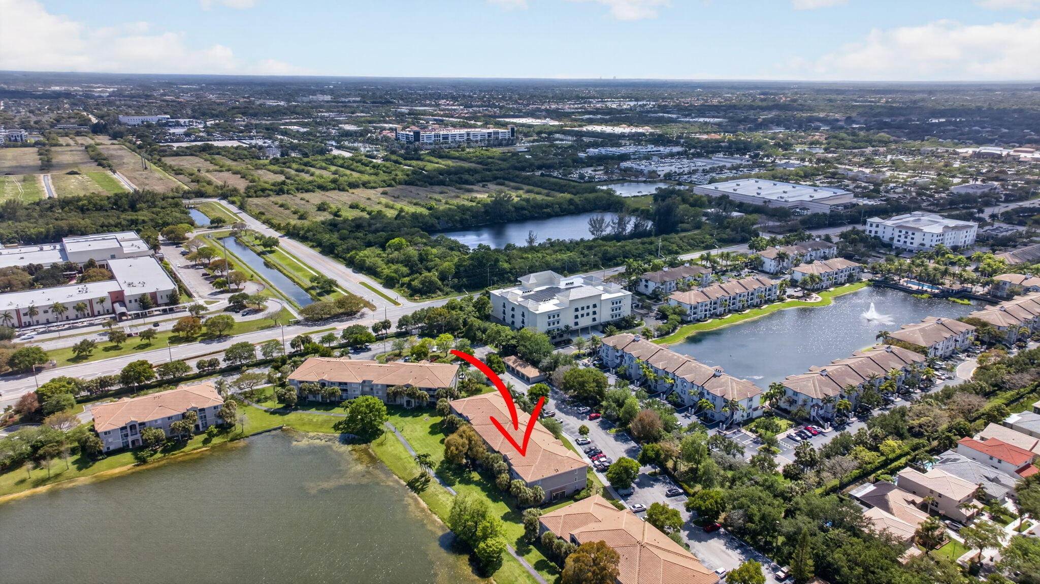 5011 Wiles Road, Unit 104 Coconut Creek, FL 33073 - Photo 38 of 43 an aerial view of residential houses with outdoor space and swimming pool