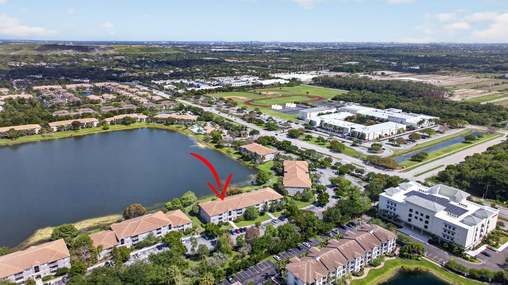 5011 Wiles Road, Unit 104 Coconut Creek, FL 33073 - Photo 39 of 43 an aerial view of a city