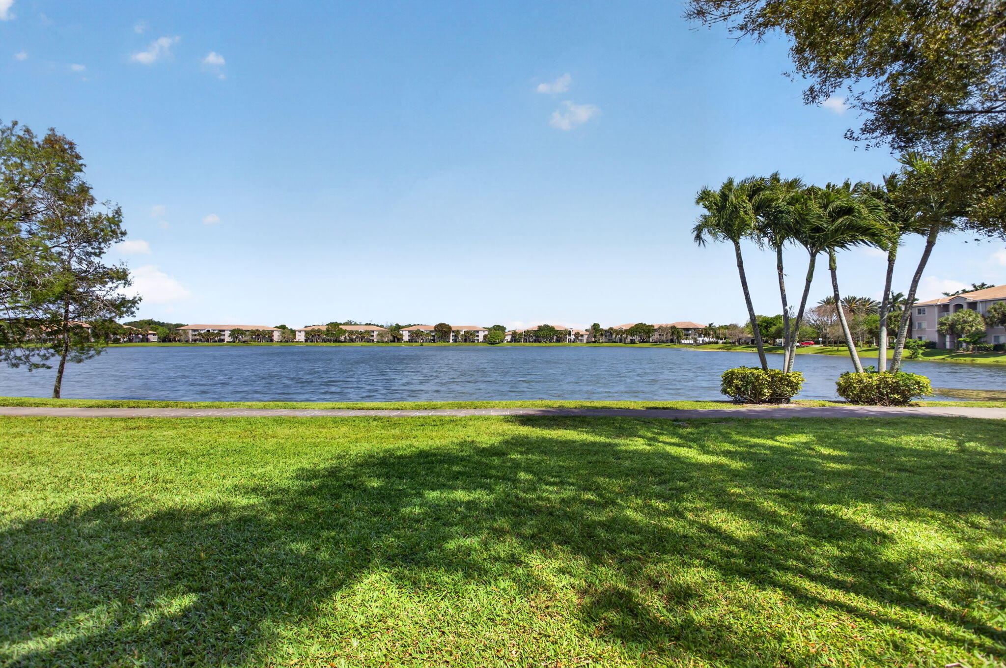 5011 Wiles Road, Unit 104 Coconut Creek, FL 33073 - Photo 6 of 43 a view of a swimming pool and an outdoor space