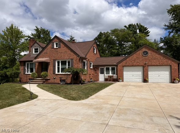 7797 York Road Cleveland, OH 44130 - Photo 1 of 23 View of front of property featuring a garage and a front lawn