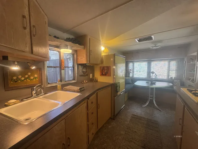 a bathroom with a sink double vanity and a mirror