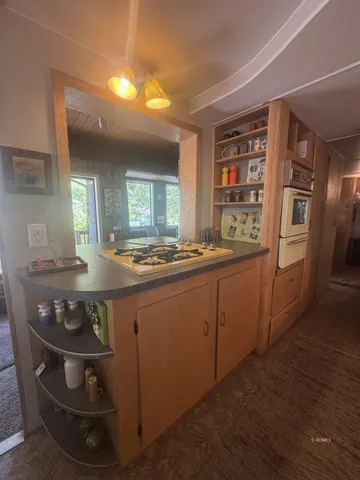 a kitchen with stainless steel appliances granite countertop a stove and a refrigerator