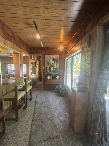 a large room with lots of furniture and a large window