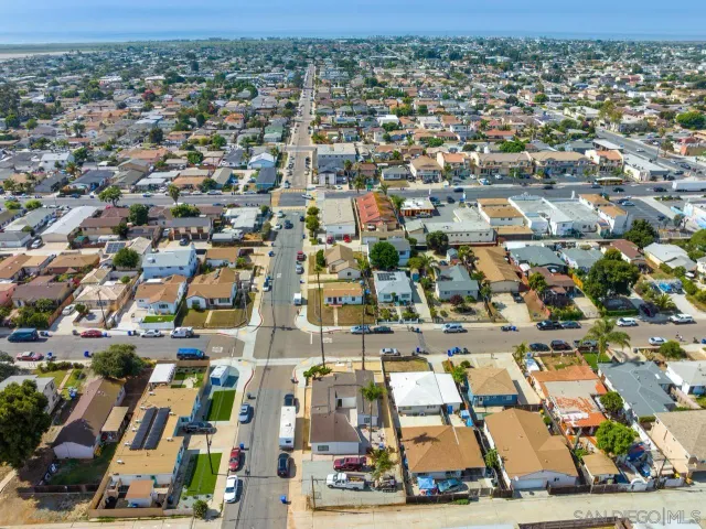 an aerial view of residential houses with outdoor space