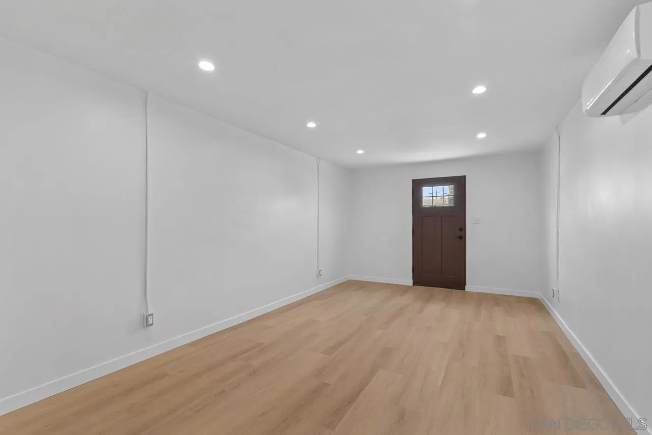 1195 Georgia Street, Unit B Imperial Beach, CA 91932 - Photo 8 of 17 a view of an empty room with wooden floor and closet