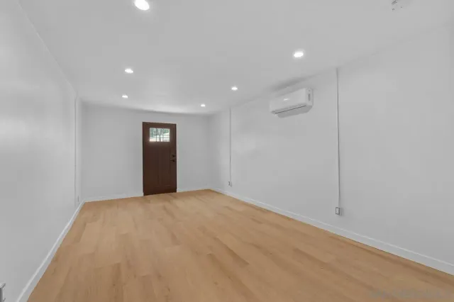 a view of an empty room with windows