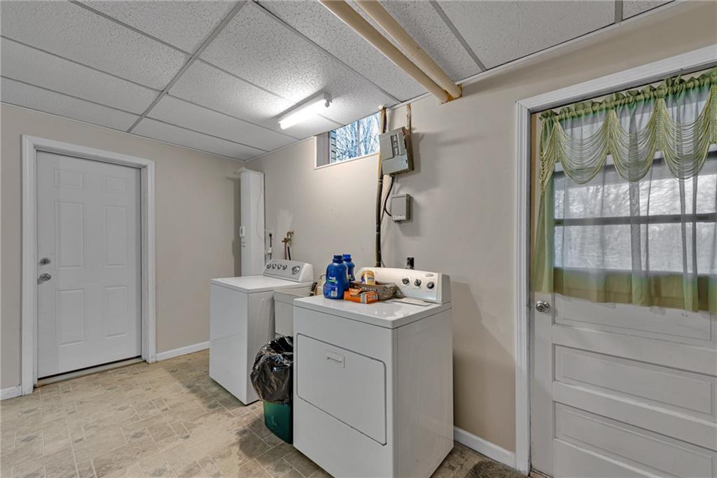 565 Upper Middletown Road Smock, PA 15480 - Photo 22 of 25 a utility room with sink dryer and washer