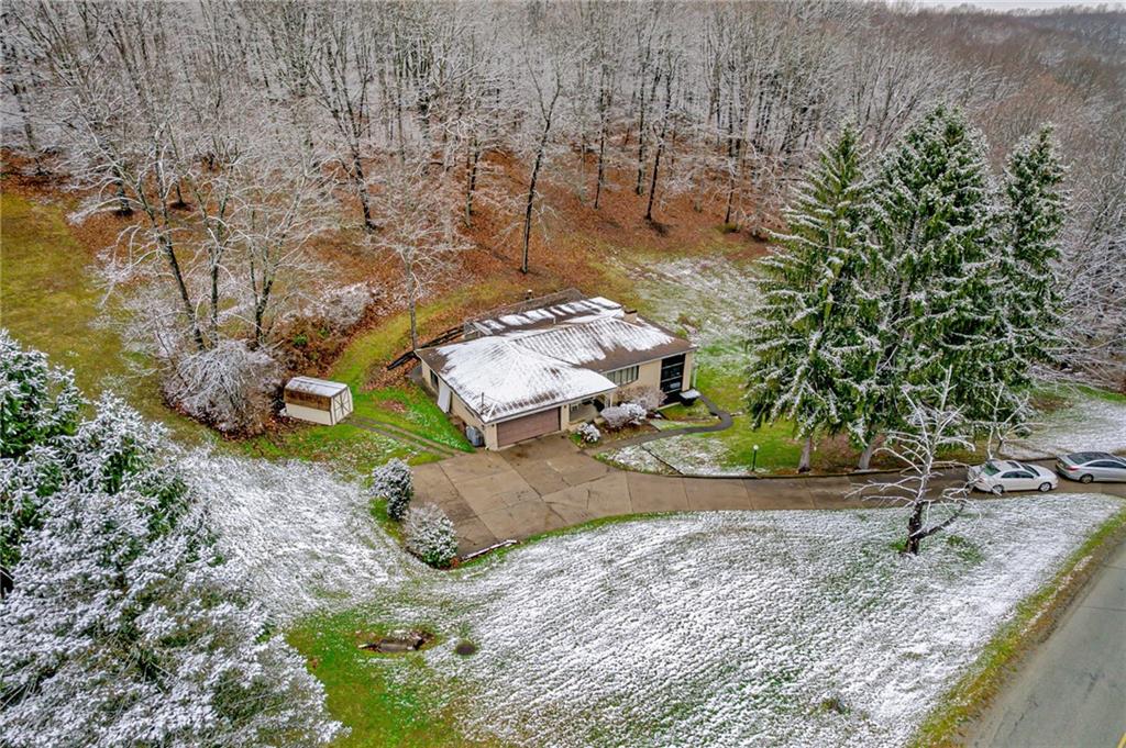 565 Upper Middletown Road Smock, PA 15480 - Photo 3 of 25 a view of a backyard with a garden