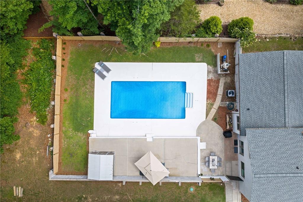 4205 South Berkeley Lake Road Northwest Berkeley Lake, GA 30096 - Photo 26 of 34 an aerial view of a house with a yard
