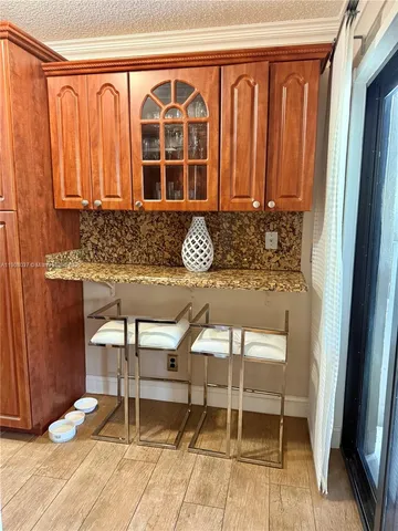 a kitchen with stainless steel appliances granite countertop a stove and a microwave