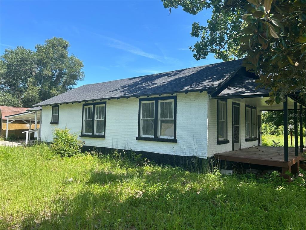1059 South Moody Road Palatka, FL 32177 - Photo 2 of 12 a view of backyard with a garden and plants