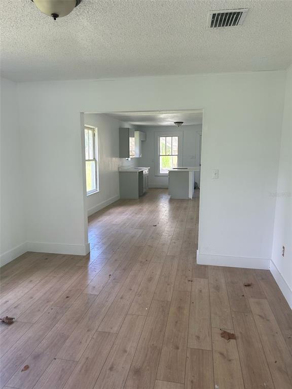 1059 South Moody Road Palatka, FL 32177 - Photo 6 of 12 wooden floor in an empty room with a window