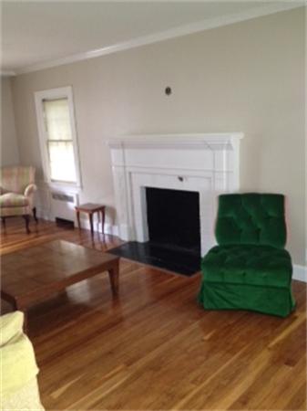 145 Bonad Road Brookline, MA 02467 - Photo 4 of 4 a living room with furniture and a fireplace