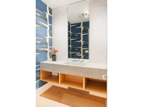 a bathroom with a granite countertop sink mirror bathtub and shower