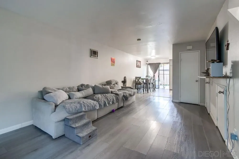 3433 Los Mochis Way Oceanside, CA 92056 - Photo 12 of 45 a living room with furniture and a wooden floor