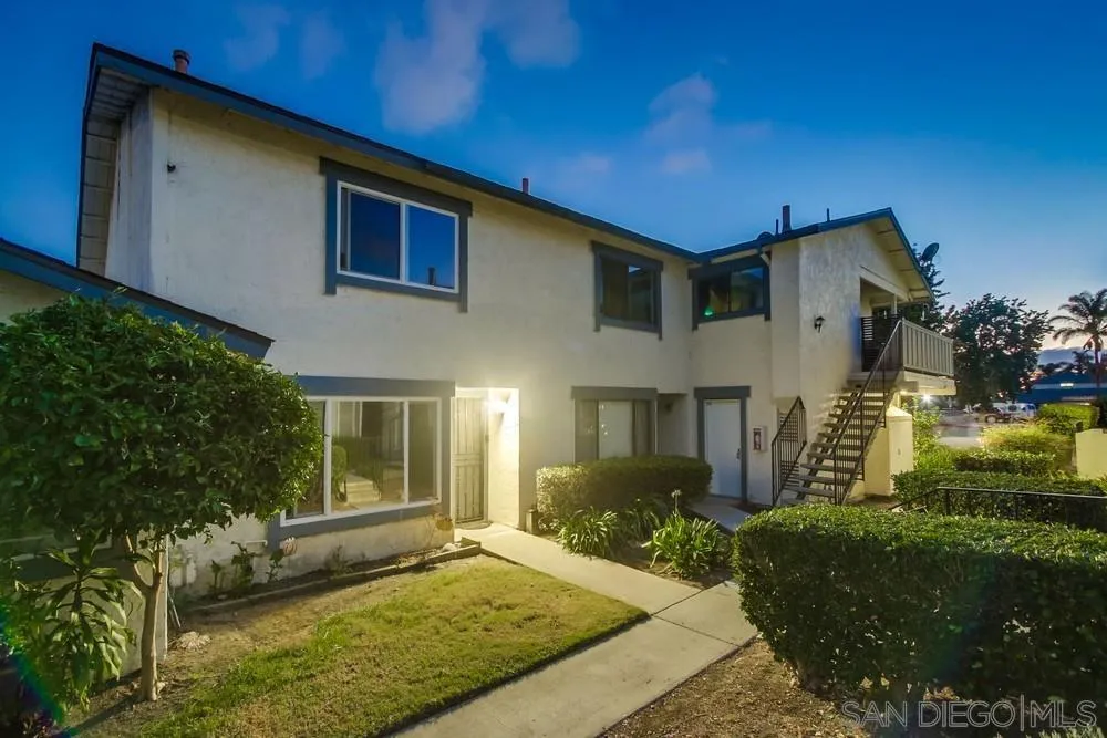 3433 Los Mochis Way Oceanside, CA 92056 - Photo 2 of 45 a front view of a house with a yard