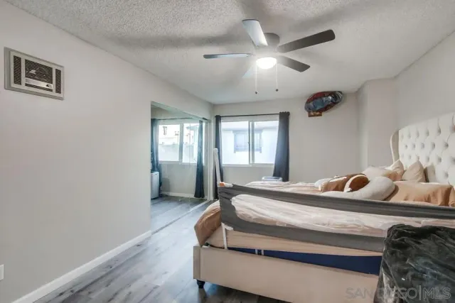 a bedroom with bed and window