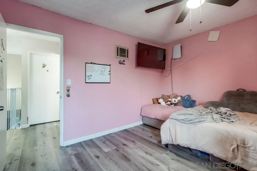 3433 Los Mochis Way Oceanside, CA 92056 - Photo 33 of 45 a bedroom with a bed and a flat screen tv
