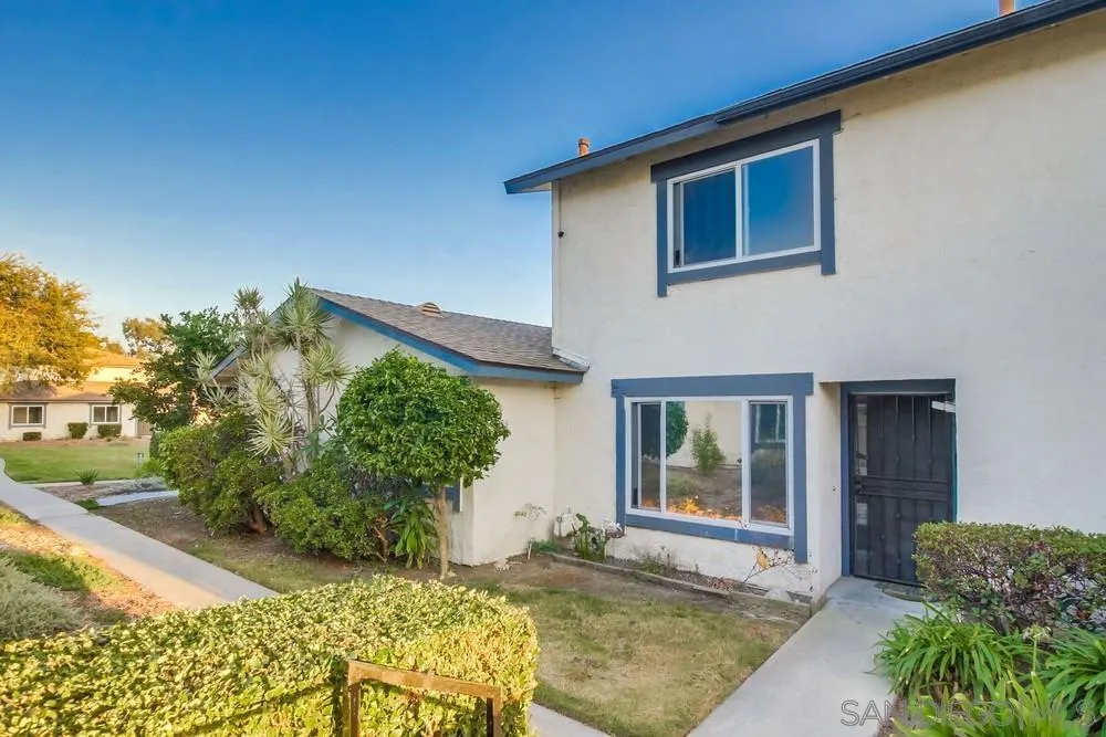 3433 Los Mochis Way Oceanside, CA 92056 - Photo 36 of 45 a front view of a house with garden