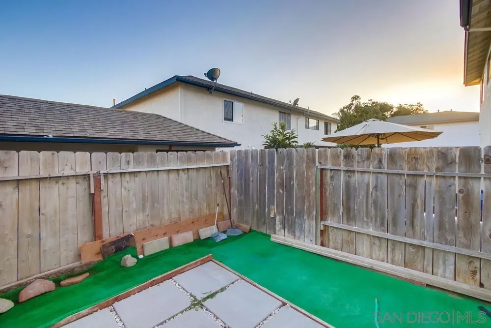 3433 Los Mochis Way Oceanside, CA 92056 - Photo 40 of 45 a view of a house with wooden fence
